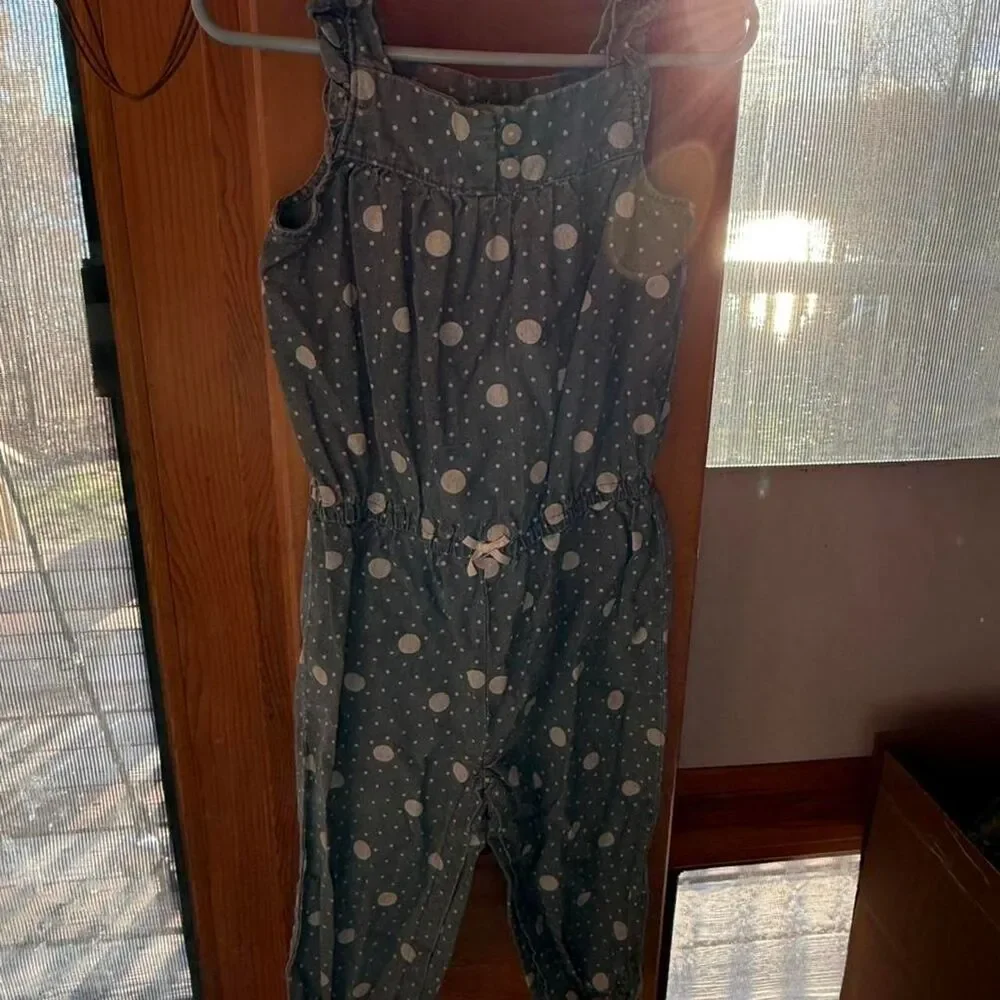 Carter's blue polka dot jumpsuit with bow detail Size: 24 months